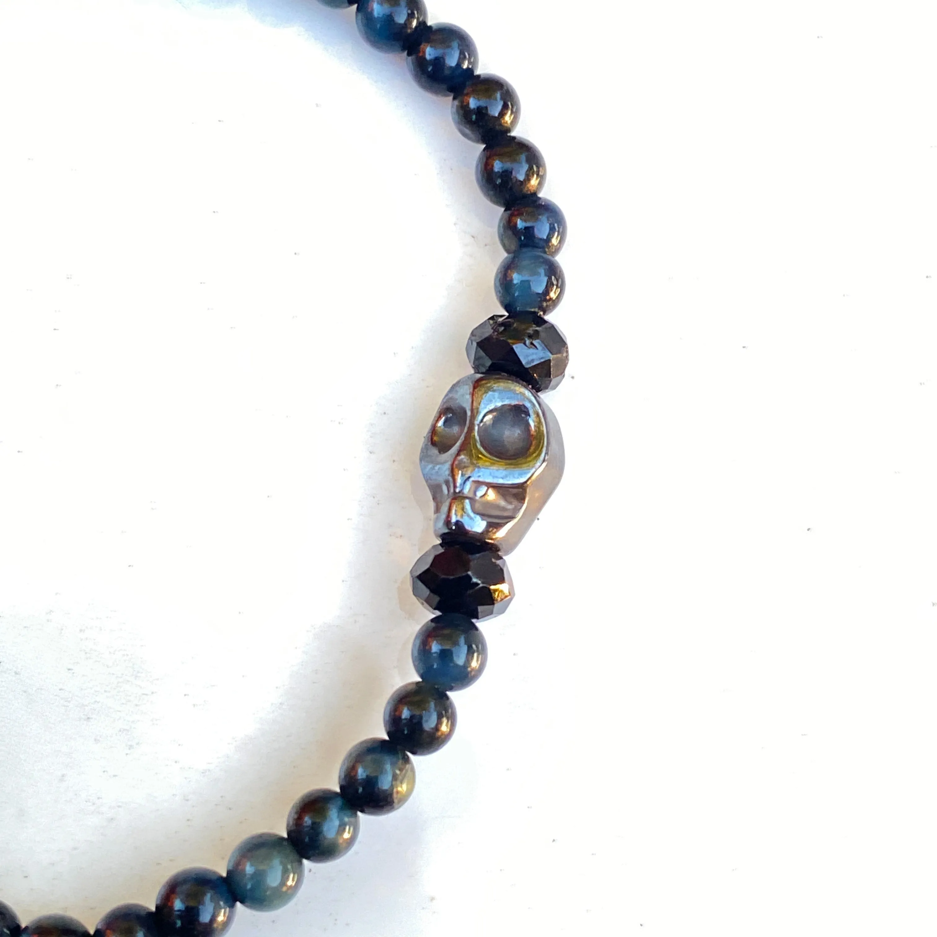 Blue Tiger Eye gemstones, Black Spinel, and Hematite Skull Women’s Stretch Bracelet