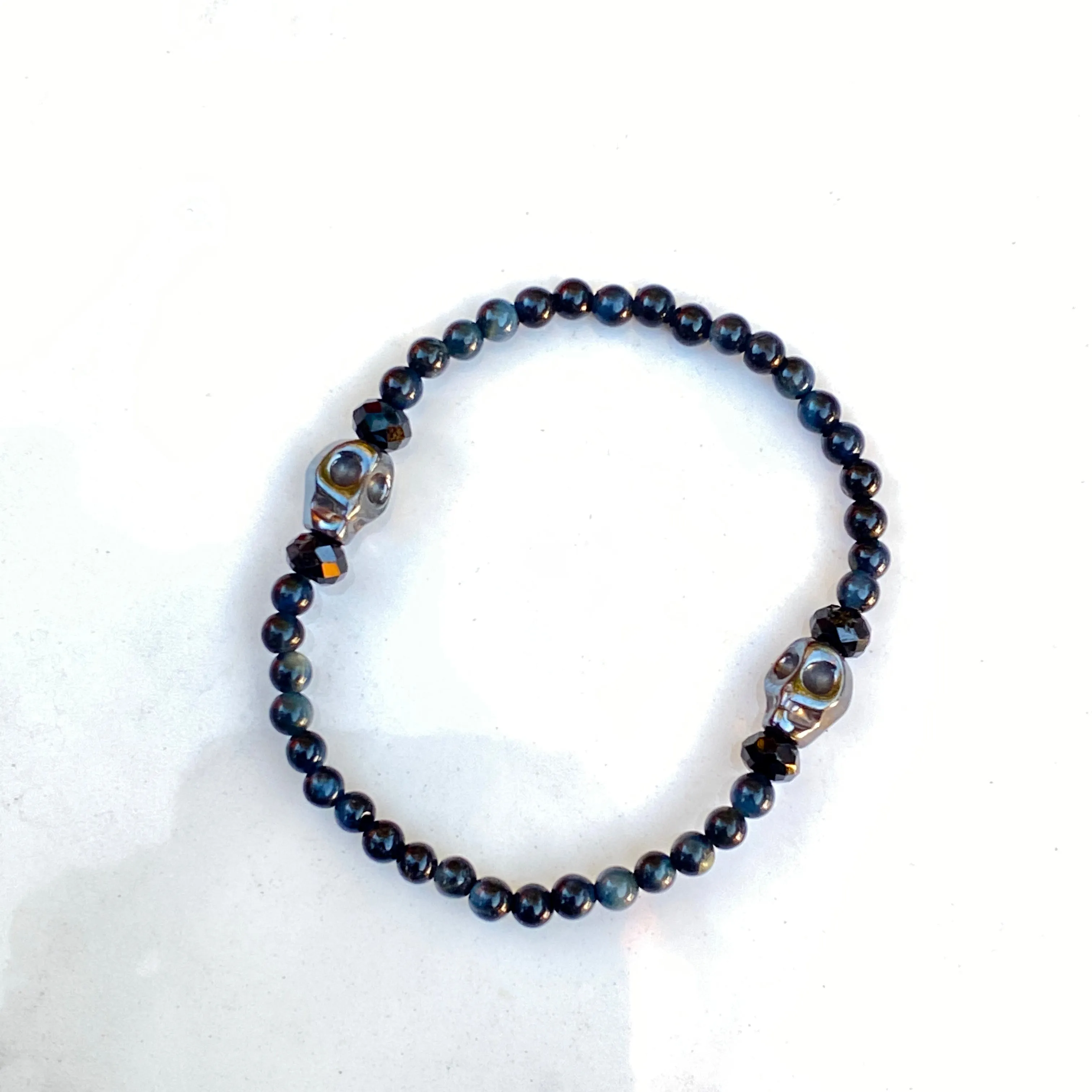 Blue Tiger Eye gemstones, Black Spinel, and Hematite Skull Women’s Stretch Bracelet