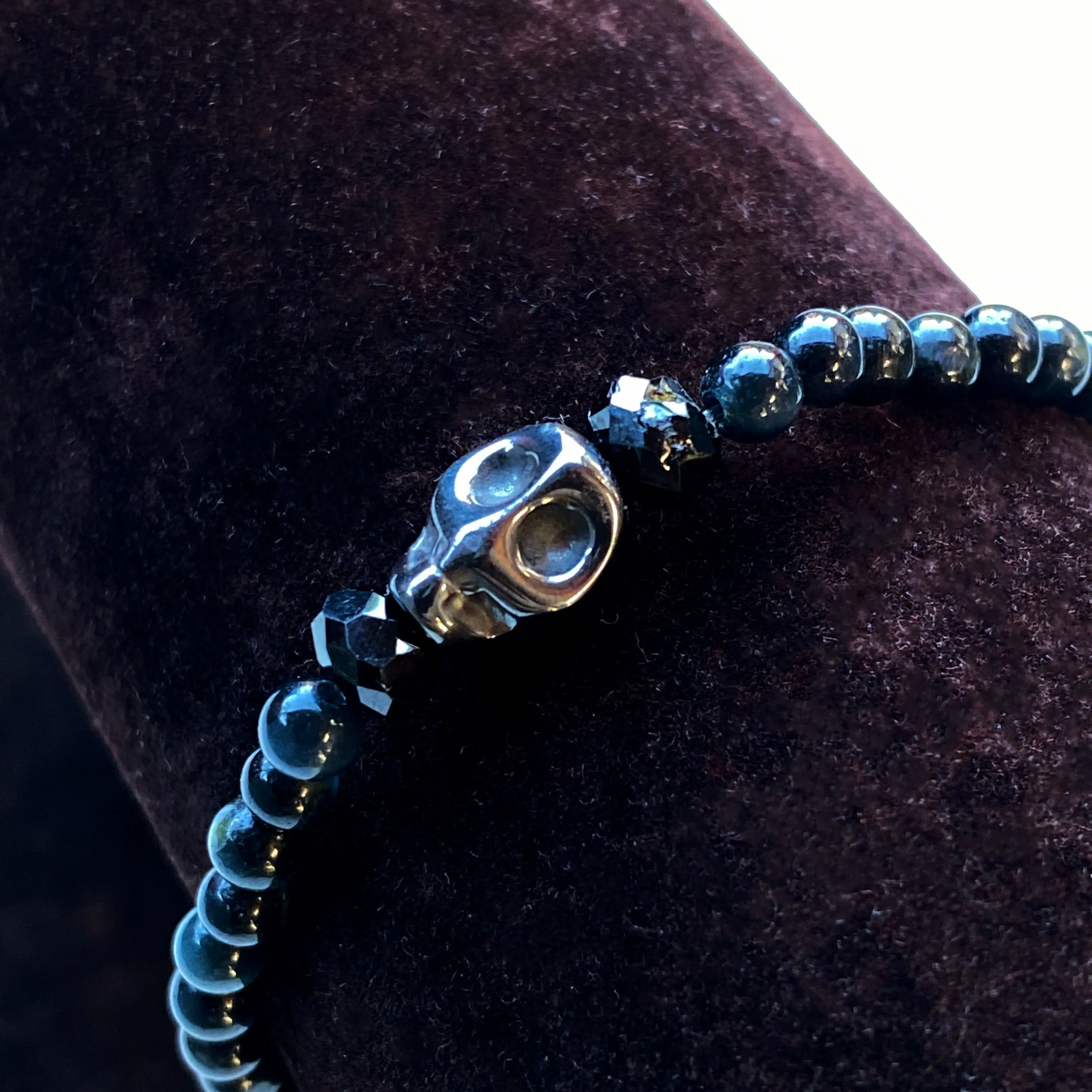 Blue Tiger Eye gemstones, Black Spinel, and Hematite Skull Women’s Stretch Bracelet