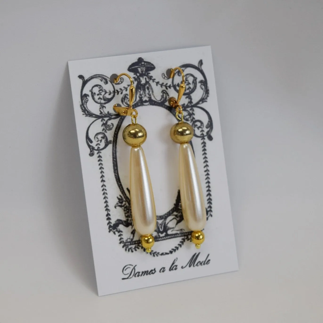 Long Pearl Teardrop Earrings with Golden Beads